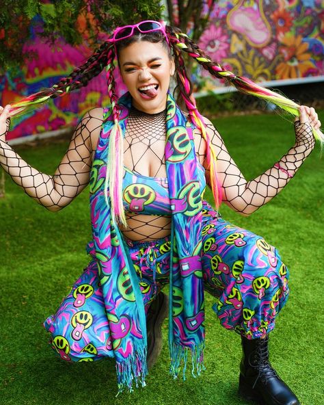 Put on the Happy Hour Set and instantly feel the night come alive! This multicolored set has a comfortable fit, and a crazy good UV-reactive print that produces a euphoric neon glow under festival lights. #ravesets #raveoutfit #festivaloutfit #electricdaisycarnival #electriclove #trippy #trippyoutfits #electriclove #iheartraves #uvreactive Basic Baddie Outfits, Bonnaroo Fashion, Neon Rave Outfits, Bonnaroo Outfits, Glow Outfits, Trippy Clothes, Neon Carnival, Rave Outfits Edc, Cami Outfit