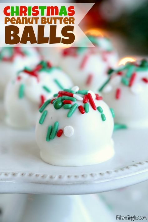 Christmas Peanut Butter Balls - Scoops of creamy peanut butter, rolled into balls, dipped in white chocolate and covered with sprinkles for the holidays!! #bitzngiggles #peanutbutter #Christmas #peanutbutterballs #truffles #chocolate #candy #recipe #sprinkles #nobake Christmas Peanut Butter Balls, Christmas Peanut Butter, Truffles Chocolate, White Almond Bark, Frozen Dessert Recipe, Butter Balls, Candy Recipe, Christmas Food Gifts, Almond Bark