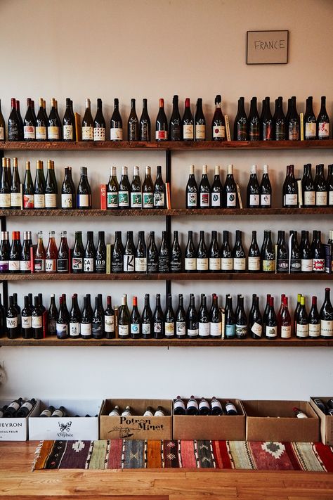 This image may contain Bottle Drink Beverage Wine Alcohol Beer Wine Bottle and Shelf Wine Store Design, Wine Shop Interior, Wine Bar Design, Wine Bottle Wall, Beer Shop, Wine Merchant, Wine Shelves, Bottle Wall, Wine Shop