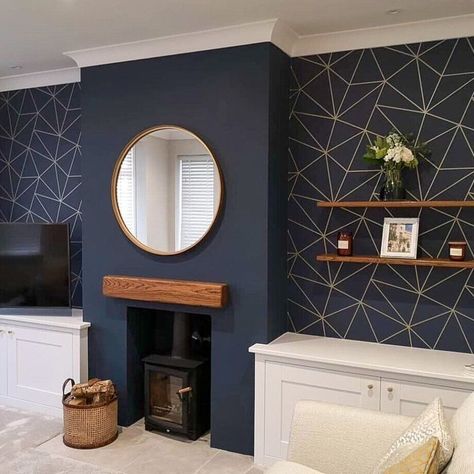 IMAGE: @ilovewallpaper.co.uk Chimney breasts make for such a valuable interiors feature in homes new and old. But how do we make the most of them? Architecturally, having a protruding wall makes for a focal point in the room, especially with the added jazz of a fireplace. And one of the simplest and most effective ways to decorate a feature like a chimney breast is with wallpaper. Chimney Breast Wallpaper, Living Room Design Blue, Antique Bookshelf, Log Burner Living Room, Navy Living Rooms, Feature Wall Living Room, Blue Living Room Decor, Gold Living Room, Chimney Breast