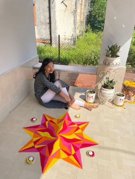 Pink red orange yellow rangoli in a circle gemoetrical pattern Rangoli With 3 Colours, Diwali Rangoli Circle, Circle Rangoli Designs Diwali, Geometric Rangoli Designs, Rangoli Circle, Yellow Rangoli, Circle Rangoli Design, Geometric Rangoli, Circle Rangoli