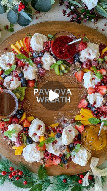 Vanya Insull on Instagram: "✨ Christmas Mini Pavlova Wreath ✨ Day 8 of 25 days of Christmas Recipes 🎄🎅🏼 🎁 Ingredients: MINI PAVLOVAS * 4 egg whites * 1 cup caster sugar (200g) * 1 tsp vanilla essence * 1 tsp white vinegar RASPBERRY SAUCE * 1 cup frozen raspberries * 1 Tbsp caster sugar CHOCOLATE GANACHE * 120g dark chocolate * 200ml cream TO SERVE * 60g passionfruit curd * 125g fresh raspberries * 250g strawberries * 1 Mango, sliced * 3 Kiwifruit, sliced * 125g blueberries * 125 pomegranate seeds * 1 Tbsp icing sugar * 1 Tbsp fresh mint leaves * 1 flake bar 30g * 500ml cream, whipped Method: 1. Mini Pavlovas: Preheat oven to 170ºC fan bake and line two trays with non-stick baking paper. 2. Add egg whites to the bowl of an electric mixer and whisk on high speed until stiff peaks form. A Pavlova Wreath, Passionfruit Curd, Christmas Pavlova, Mini Pavlovas, Mini Pavlova, Frozen Raspberries, Xmas Treats, Christmas Platter, Pavlova Recipe