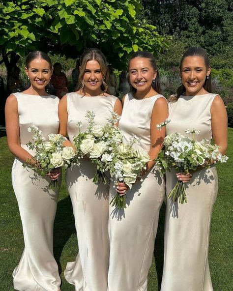 Celebrating Mr & Mrs Dodd! 💐 These beautiful bridesmaids wore our most popular dress 'Joy in Champagne Gold Satin' for the celebration of @homewithkat_ wedding day. For a chance to be featured on our page, be sure to tag us, or send your wedding photos via DM. 💌 We LOVE to see them! Are you looking for a high-quality, sustainable dress for your bridesmaids? ✨ Discover our elegant range of bridesmaid dresses that are perfect for each season. Please click the link in our bio. #bridesmaids... Ivory Silk Bridesmaid Dresses, White Gold Bridesmaid Dresses, Cream Coloured Bridesmaid Dresses, White Champagne Wedding Color Schemes, Classic Elegant Bridesmaid Dresses, Winter Wedding Colors Gold Champagne Bridesmaid Dresses, Champagne Wedding Bridesmaid Dress, Bridesmaids Fall Colors, Champagne Winter Bridesmaid Dresses