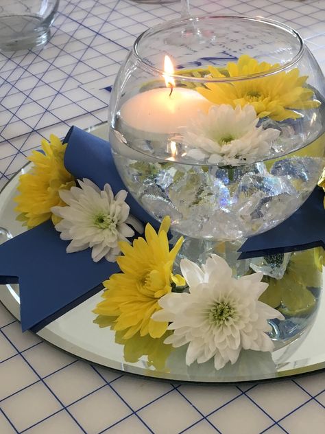 Navy And Yellow Table Decor, Navy And Yellow Bridal Shower Ideas, Yellow Centerpiece Ideas, School Banquet Centerpieces, Blue And Gold Graduation Party Ideas Table Decorations, Yellow Party Decorations, Simple Floral Centerpieces, Sunflower Wedding Centerpieces, Diy Dollar Tree Gifts