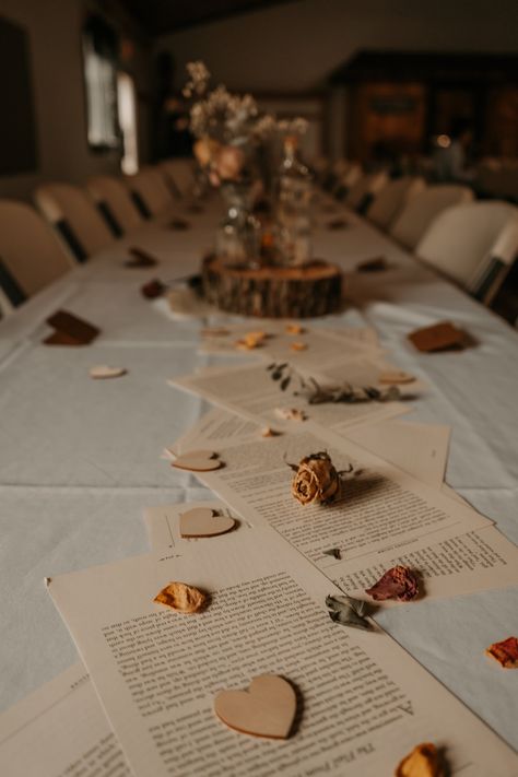 Using fairytale book pages for a table running at our Love Story wedding - Whimsical Book Pages Table Decor, Fairytale Inspired Wedding, Wedding Book Table Ideas, Book Wedding Arch, Book Table Centerpieces Wedding, Story Book Decorating Ideas, Love Story Theme, Book Arch Wedding, Poetry Decor Ideas