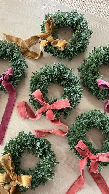 Amanda // Party + Home 🤍 on Instagram: "I found the DREAMIEST velvet ribbon at hobby lobby & had to use it on these cutie mini wreaths (also from hobby lobby)! 🎄 you can tie it on the wreath or use hot glue (like I did). Mini wreaths are one of my very favorite Christmas decorations! I put them on the backs of our dining chairs & hang them up all over the house! ✨ Do you guys love them too?! #miniwreath" Christmas Mini Wreaths, Christmas Lobby Decor, Small Wreath Ideas, Mini Wreath Diy, Mini Wreaths Christmas, Lobby Decor, Small Wreaths, Mini Wreaths, Diy Outdoor Decor