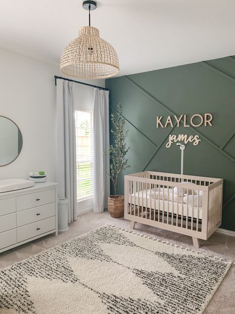 Green White And Wood Nursery, Nanit Wall Mount Nursery, Neutral Nursery Minimalist, Sage Green Nursery Gender Neutral Accent Wall, Modern Green Nursery, Accent Walls For Nursery, Hunter Green Accent Wall Nursery, Nursery Ideas Olive Green, Hunter Green Boy Nursery