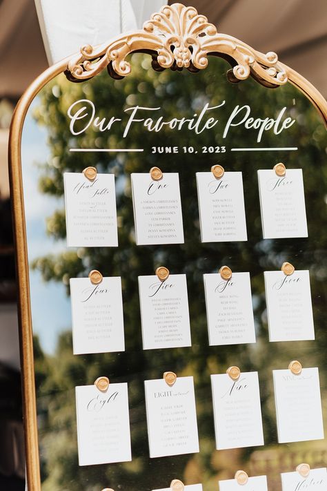 Wedding Table Number Board Ideas, Table Plan Board Wedding, Table Seating On Mirror, Wedding Mirror Table Seating, Summer Wedding Seating Chart Ideas, Table Board Wedding, Wedding Signage Table Assignments, Unique Wedding Seating Chart Display, Wedding Table Board Seating Charts