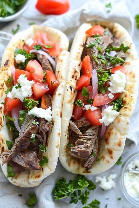 Experience homemade Mediterranean excellence with my Flavorful Greek Gyro recipe! Made with succulent lamb, crisp veggies, and tangy tzatziki sauce, these gyros are a true culinary masterpiece. Discover the recipe on my website and elevate your dining experience! Greek Gyro Recipe, Gyro Recipe, Tzatziki Sauce, The Mediterranean, Pita, The Recipe, My Website, Meat