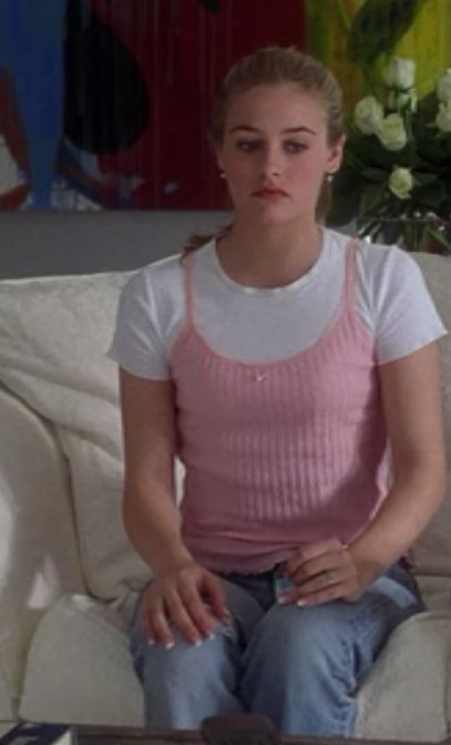 Extra points for basically inventing the trend where girls wore spaghetti strap tanks over t-shirts. | An Extensive Ranking Of 116 "Clueless" Outfits Top Over Shirt Outfit, Tank Top Over Shirt, Cher Outfits, Stacey Dash, Cher Clueless, Clueless Fashion, Cher Horowitz, 90s Inspired Outfits, Clueless Outfits