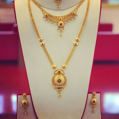 RathyJewellers New Branch. on Instagram: “Full Bridal set with Ruby gem stones. Long Patta set, Necklace, Earrings and Tikka. Complete set for the big day. Rathy Jewellers New…” New Gold Jewellery Designs, Gold Jewelry Simple Necklace, Gold Mangalsutra Designs, Gold Necklace Indian Bridal Jewelry, Gold Bridal Jewellery Sets, Gold Necklace Simple, Gold Jewelry Stores, Gold Pendant Jewelry, Gold Bride Jewelry