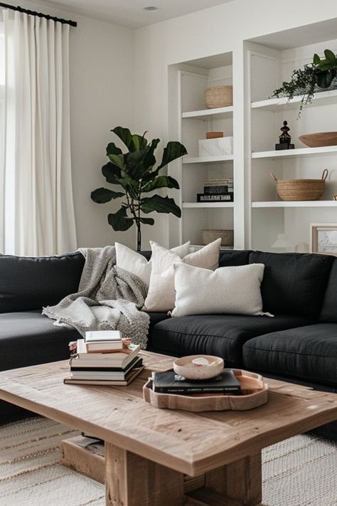 Gray Couches Decor, Lounge Decor Black Sofa, Apartment Living Room Dark Couch, Grey Couch Living Room Scandinavian, Black Couch With Pillows, Black White And Wooden Living Room, Charcoal Sofa Decor, Neutral Living Room With Black Couch, Living Room With Charcoal Sofa