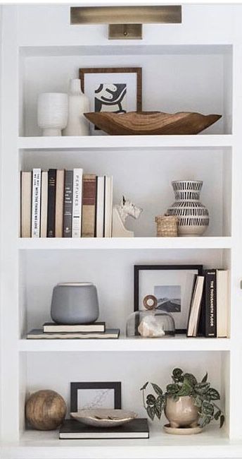 Black And Neutral Shelf Decor, Feminin Office Work Spaces, Living Room Built In Cabinets With Doors, Tv Shelf Decorating Ideas, Five Shelf Bookcase Decor, Bathroom Makeup Mirror Ideas, Office Credenza Styling, How To Make Books Look Good On A Shelf, Narrow Dining Room Built Ins