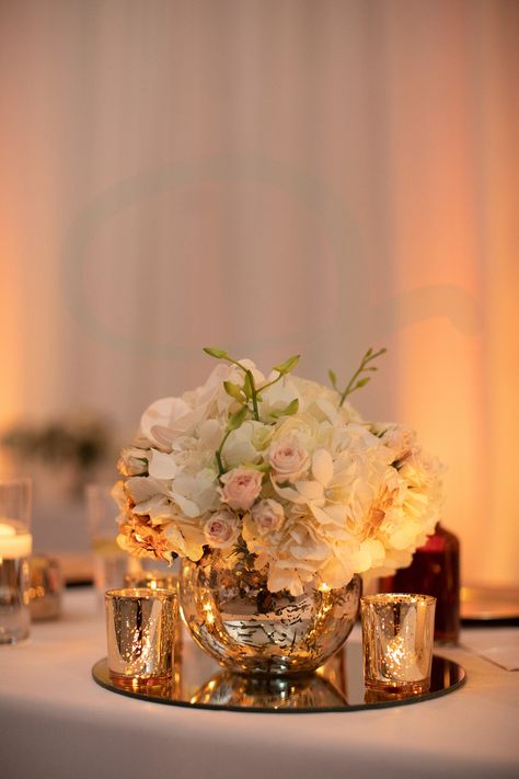 Wedding Centerpieces With Mirror Base, Gold Mercury Glass Centerpiece Wedding, Circle Mirror Centerpiece Wedding, Elegant Gala Centerpieces, Gold Mirror Centerpiece Wedding, Wedding Centerpieces On Mirrors, Mirror Centerpiece Ideas Wedding, Centerpieces With Mirror Base, Round Table Centerpieces Wedding Fairy Lights