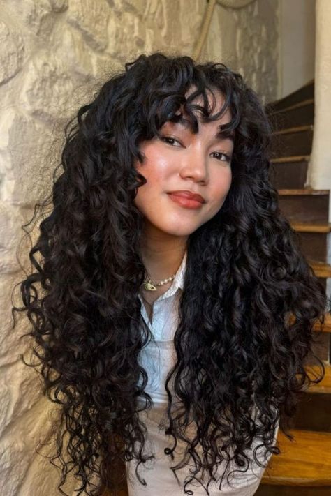 Bouncy Curls Frizzy Curly Hair Styles, Long Curls With Bangs, Long Curly Hair Round Face, Ashy Brown Curly Hair, Curly Hair Women Aesthetic, Curly Butterfly Cut, Curly Hair Cuts With Bangs, Long Curly Hair With Bangs And Layers, Long Black Curls