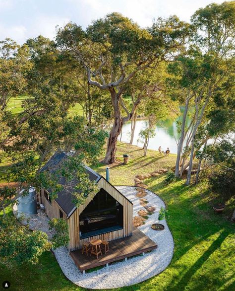 Nestled in the heart of Margaret River, this cabin isn't just a place to stay; it’s a story. The timber? Lovingly milled by the owner's dad from their family farm. This eco-luxe retreat marries local craftsmanship with luxury, setting the scene for those who adore the finer things but crave the simplicity of nature.   So, crack open a bottle, throw on your comfiest jumper, and pretend the outside world doesn’t exist.  📷 @dylan_alcock Farm Stay Ideas, Cabin By River, Virgin River Cabin, Rural Airbnb, Cabin Near River, River Retreat, Vintage Bathtub, Eco Cabin, Outdoor Bath