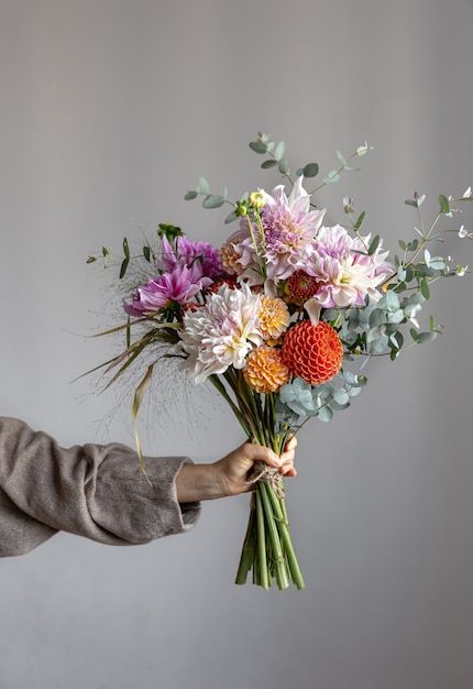 Free Photo | A woman is holding a festive bouquet with chrysathemum flowers in her hands. Hand Holding Bouquet, Yellow Spring Flowers, Holding Bouquet, Flower Boquet, Giving Flowers, Reference Photos For Artists, Portfolio Ideas, Flower Inspiration, Rose Vase