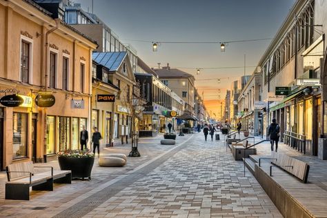 The design derives from the contemporary needs of a functional yet attractive pedestrian street in the city center. We aimed to create an inviting street on a human scale with a unique and clear identity. Design concepts focused on richness in experience, timelessness and small scale. The city’s main shopping street targets a unique identity […] Shopping Street Design, Shopping Street Architecture, Street Scape Design, Street Design Ideas, Pedestrian Street Design, Street Market Design, Commercial Street Design, Urban Street Design, Garden Alley