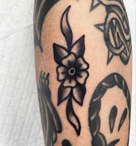 American Traditional Flower Filler, Traditional Style Leg Tattoos, Beginner Traditional Tattoo, Simple Traditional Tattoo Design, Tiny Traditional Tattoo Filler, Black And Grey American Traditional Tattoo, Traditional Arm Band Tattoo, Trad Gap Filler Tattoos, American Traditional Gap Filler Tattoos