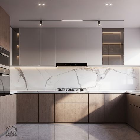 A pleasant and beautiful cooking area with a simple modern kitchen design in white and beige tones. White marble walls exude elegance and sophistication, while minimalist cabinetry and counters maintain a clean, uncluttered appearance. This balanced combination of colors and materials creates a timeless and warm atmosphere suitable for any home. 

#ModernKitchen #WhiteAndBeige #MarbleWalls #MinimalistDesign #InteriorDesign #kitchenIdeas #homeDecor #kitchen_design_modern_small Kitchen Design Small Simple, Beige Minimalist Kitchen, Kitchen Combination Colors Modern, Kitchen Design White Countertops, Kitchen White And Brown Modern, Kitchen Modern Beige, Simple Modern Kitchen Design, Kitchen White And Wood Modern, Modern Two Tone Kitchen Cabinets