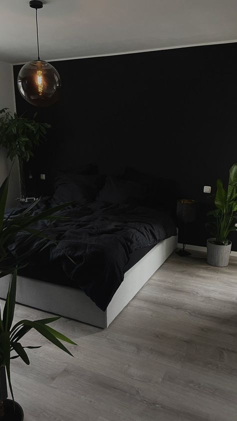 "Transform your bedroom into a cozy sanctuary with these simple and easy ideas! ✨ Discover budget-friendly tips for creating a dreamy space, from stylish decor to clever storage solutions. Dive into a world of comfort and style – because a good night's sleep begins with a beautiful bedroom. 💤 #BedroomIdeas #CozySpaces #HomeDecor" Dark Black Bedroom Aesthetic, Mens Bedroom Aesthetic Dark, Black Walls Room Aesthetic, Black Room Minimalist, Black Apartment Aesthetic Bedroom, Men’s Black Bedroom, Modern Black And Wood Bedroom, Room With One Black Wall, Black Earthy Room Aesthetic