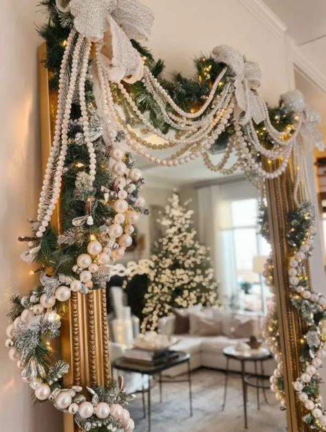 22 Stunning Mirror Decorating Ideas for Christmas Festivities Big Window Christmas Decor Ideas, Wreath On Mirror Ideas, Christmas Garland Decor Ideas, Christmas Decor Ideas For Chandelier, Mirror Christmas Decor Ideas, Christmas Mirror Decor, Christmas Mirror Decorations Ideas, Pearl Garland Christmas, Mirror Christmas Decor