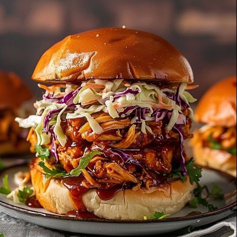 🍗 Pull up for our mouth-watering Pulled Chicken Sandwiches! 🥪 #SandwichTime Pulled Chicken Sandwiches Ingredients: Cooked chicken, shredded (3 cups) BBQ sauce (1 cup) Coleslaw mix (2 cups) Buns (4) Instructions: Mix shredded chicken with BBQ sauce. Heap onto buns and top with coleslaw. Serve immediately. 🌟 Enjoy the rich flavors of our Pulled Chicken Sandwiches, a guaranteed hit for any meal or gathering! #FlavorfulBites Chicken With Bbq Sauce, Pulled Chicken Sandwiches, Chicken Shredded, Instagram Recipes, Twisted Recipes, Chicken Sandwiches, Sandwich Ingredients, Pulled Chicken, Cooked Chicken