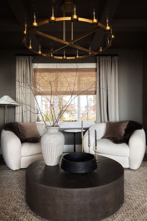 Our Sitting Room is the perfect space for that extra cup of coffee. Oversized chairs, natural elements, and a moody and cozy paint