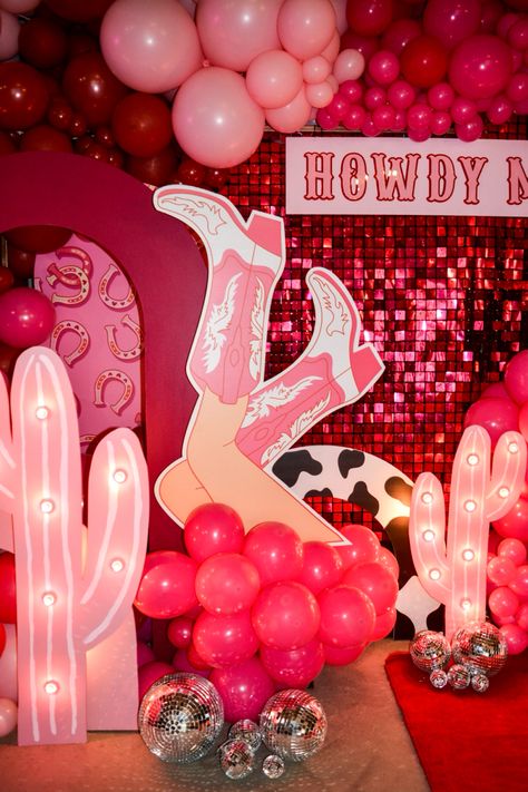 Howdy 18th birthday party, Cowgirls and disco balls. Lets go girls! Light up cactus in a light pink with the light up 18 and custom signage Howdy Maddy. Cowboy Pink Party, Cowgirl Pink Party Ideas, Disco Cowgirl Birthday Party One, Pink Western 21st Birthday Party, 18th Cowgirl Party, Glam Cowboy Party, Cowboy Disco Birthday Party, Disco Cowgirl Bday Party, Cowgirl Pink Birthday Party