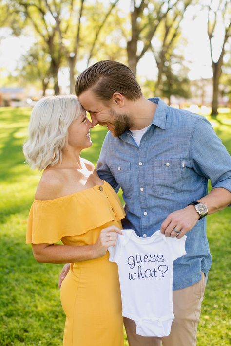 Onesie pregnancy announcement idea Onsie Maternity Picture, Maternity Photography With Onesie, Maternity Photos With Onesie, Pregnancy Announcement With Onesie, Baby Announcement Photoshoot With Kids, Baby Onesies Announcement, Pregnancy Announcement Family Photos, Pregnancy Reveal Pictures, Pregnancy Reveal Photoshoot