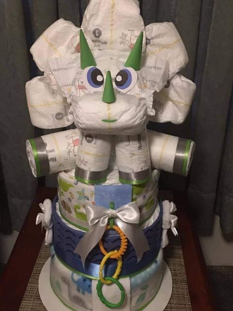 Diaper Cake Dinosaur Theme, Land Before Time Baby Shower Ideas, Dinosaur Diaper Cake, Dinosaur Baby Shower Games, Dinosaur Baby Shower Theme, Diaper Gifts, Diaper Cake Boy, Baby Shower Diaper Cake, Baby Dinosaur