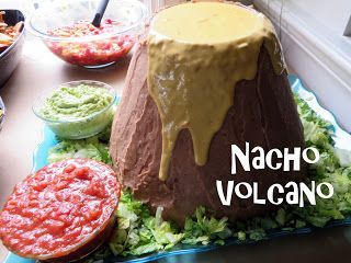 The Good Dinosaur Birthday Party! Easy and delicious nacho snack that looks like a volcano! Caveman Birthday Party Ideas, Volcano Themed Food, Volcano Party Food, Dinosaur Taco Party, Jurassic Park Themed Food, Nacho Volcano, Dinosaur Birthday Food Ideas, Jurassic Park Party Food, Dino Themed Food