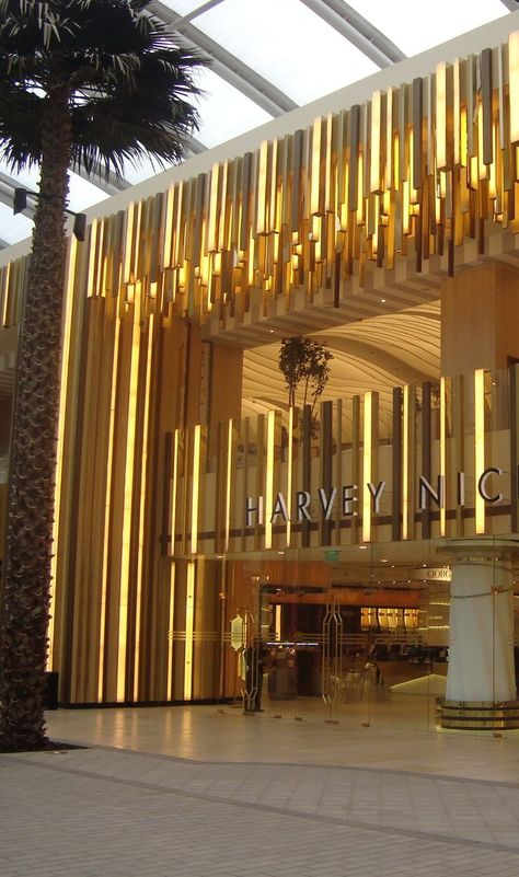 Ripples of Gold PVD to exterior of Harvey Nichols store, The Avenues, Kuwait Avenues Kuwait, Retail Facade, Storefront Design, Facade Lighting, Home Luxury, Shop Front Design, Logo Vintage, Retail Interior, Shop Front