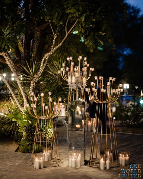 We recreated a mini paradise for the #Phera ceremony where every corner echoed a tale of surreal romanticism and delicate blossoms filled the air with their serene scents. Decor & design: @oneworldunited.in Wedding planner: @unavida_weddings Wedding venue: @alilafortbishangarh Florals: @diamondflorist_jaipur Props & Candles: @shinecollectionbydeepaksharma Furniture: @silverline_rentals 📞 097995 35809 📩 oneworldunitedoffice@gmail.com #wedding #weddingdecor #eventmanagement #decor #ind... Night Outdoor Wedding Decor, Diwali Event Decor, Floral Stage Design, Surreal Romanticism, Cocktail Event Decor, Phera Mandap Decor, Wedding Cocktail Decor, Diwali Props, Sufi Night Decor