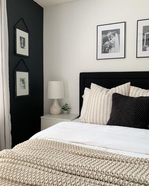 This bedroom features a black headboard bed with white, beige and black bedding. A beige bedroom lamp with white lampshade is placed next to the bed on a light gray bedside table. Black Furniture White Room, Black And White Bedside Lamp, Light Grey Black And White Bedroom, Black And Bedroom Ideas, Black Bed Beige Bedding, Black Bed Headboard Bedroom Designs, How To Decorate A Bedroom With Black Furniture, Black White Beige Bed, Black Gray Beige Bedroom