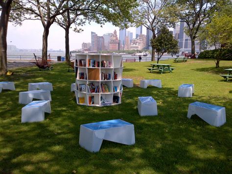 New York Public Library, Brooklyn Public LIbrary & Queens’ Library library lawn outdoor reading room on Governor’s Island ... round bookshelf and wooden benches for sitting and reading, pop up library open weekends, provides library services, summer 2013 Outdoor Reading Nooks, Outdoor Reading, Street Library, Governors Island, Outdoor Shelves, Mobile Library, Mini Library, Decorating Bookshelves, Open Library