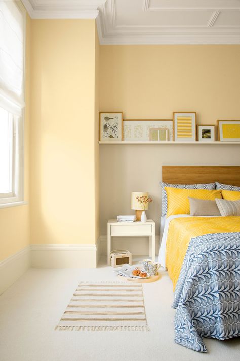 Tap into lighter shades of softer yellow if you're after something more muted. It will refresh your space while also appearing to make your bedroom feel much bigger. Top tip: add in some brighter yellow accessories to accentuate the space. (Photo: Crown) #bedroomideas #bedroomdecor #bedroomdecoratingideas #yellowgold Bedroom With Yellow Walls, Yellow Bedroom Paint, Yellow Bedroom Walls, Yellow Bedroom Decor, Yellow Bedding, Yellow Room, Yellow Bedroom, Bedroom Paint Colors, Yellow Walls