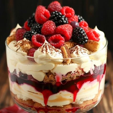 🍓🍰 Dive into layers of bliss with Berry Tiramisu Trifle! Luscious, fruity, and irresistible! #BerryDelicious #TiramisuTrifle Berry Tiramisu Trifle Recipe This trifle combines the classic flavors of tiramisu with the fresh zest of seasonal berries, making it a perfect dessert for any gathering. Ingredients: Mascarpone cheese: 250g Heavy cream: 240ml Powdered sugar: 75g Vanilla extract: 5ml Ladyfingers: 200g Mixed berries (strawberries, blueberries, raspberries): 300g Coffee (cooled): 240ml... Easy Berry Trifle Recipe, Trifles Desserts, Tiramisu Trifle Recipe, Cranberry Trifle, Blueberry Trifle Recipe, Berry Tiramisu, Trifle Bowl Recipes, Tiramisu Trifle, Raspberry Trifle