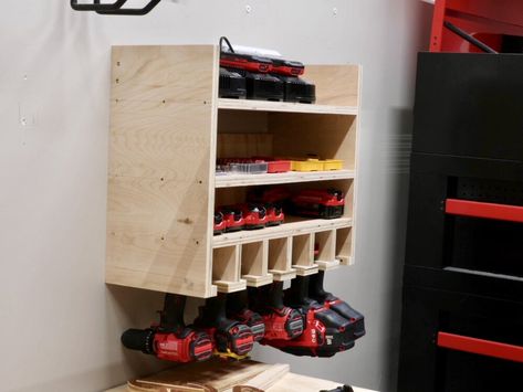 I found a great, simple design from Amy over at Her Tool Belt, which I’ll link to in the video description, and I just modified it slightly for my needs and to use up the plywood scraps I had on hand. 2x4 Workbench, Drill Charging Station, Tool Organization Diy, Battery Charging Station, Workbench Organization, Drill Storage, Organized Garage, Building A Workbench, Workshop Plans