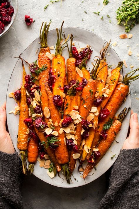 Maple roasted carrots with cranberries Sunday Roast, Carrots With Cranberries, Maple Roasted Carrots, Jul Mad, Lazy Cat Kitchen, Vegan Thanksgiving, Roasted Carrots, Veggie Dishes, Vegetable Dishes