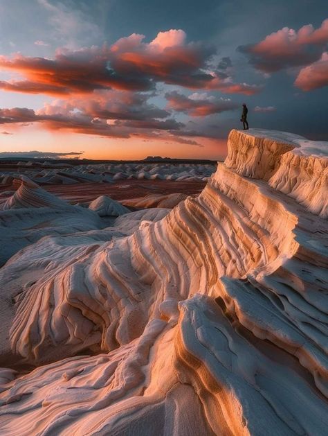 The White Desert in Arizona, where rock formations resemble waves and pink clouds fill the sky at sunset. The Wave is a sandstone rock formation located in Arizona, US, near its northern border with Utah. The formation is situated on the slopes of the Coyote Buttes in the Paria Canyon-Vermilion Cliffs Wilderness of the Colorado Plateau. Follow : The American Natu The Wave Arizona, Vermilion Cliffs, Coyote Buttes, Sandstone Rock, Paria Canyon, Rock Box, Colorado Plateau, White Desert, Desert Mountains