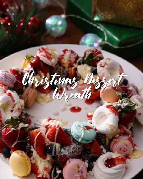 Briscoes - Christmas Dessert Wreath | dessert, wreath | This Christmas Dessert Wreath looks so impressive and is actually super simple and fun to make. In fact it almost looks too good to eat… we said ALMOST 😉 | By Briscoes Christmas Wreath Desserts, Christmas Dessert Wreath, Wreath Dessert Christmas, Dessert Wreath Christmas Treats, Choux Pastry Christmas Wreath, Wreath Macarons, Wreath Dessert, Christmas Wreath Dessert, Dessert Wreath