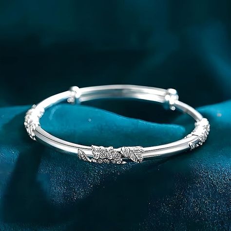 Crafted from high-quality silver, this bracelet boasts a sleek and modern design that is perfect for any occasion. The shining silver material is polished to a high shi Silver Bracelet Designs, The Bangles, Bracelets Design, Birthday Jewelry Gift, Silver Bangle Bracelets, Sterling Silver Bangles, Flower Bracelet, Blooming Flowers, Silver Bangles