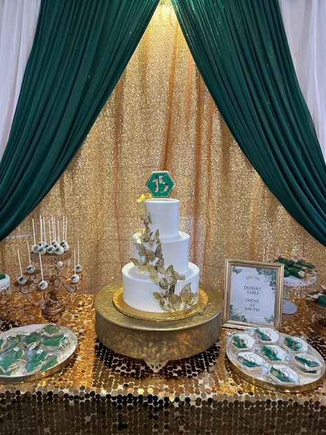 Dessert table, cake table, emerald green, gold Emerald Green Quinceanera Cake Table, Emerald Green Quinceanera Table Decor, Emerald And Gold Dessert Table, Emerald Green Quinceanera Dessert Table, Quinceañera Cake Table, Emerald Green And Gold Quinceanera Theme Decor, Emerald Green And Gold Sweets Table, Quince Main Table Ideas Emerald Green, Green White And Gold Dessert Table