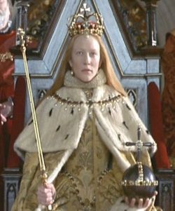 Elizabeth's played by Cate Blanchett, crown is a near accurate remake of the crown that is depicted in Elizabeth's coronation portrait.  It has large gemstones around the edge and curved casted arches that meet at a cross. It has a large pearl that hangs on the forehead. It's very regal. Elizabeth Movie, John Gielgud, Mary Of Guise, Elizabeth 1998, Geoffrey Rush, Sandy Powell, Coronation Robes, Royal Films, Colleen Atwood