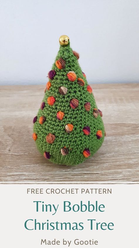 The Tiny Bobble crochet Christmas Tree is a free crochet Christmas tree pattern that you can crochet in no time! The crochet Christmas tree pattern makes a colorful crochet Christmas tree ornament decoration. Add this free crochet Christmas ornament pattern to your gift making! #crochetchristmasornaments #crochetchristmasornamentsfreepattern #crochetchristmastree #christmastreecrochetpattern #crochetchristmastreefreepattern #crochetchristmaspatterns #crochetchristmasdecorations #crochet Bobble Christmas Tree, Christmas Tree Ornament Pattern, Crochet Christmas Tree Ornament, Crochet Christmas Trees Pattern, Crochet Bloggers, Bobble Crochet, Crochet Christmas Tree, Christmas Cuties, Star Crochet