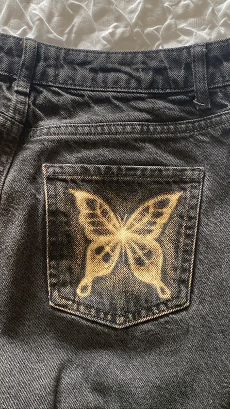 Bleach Painting On Jeans, Butterfly Painting On Jeans, Bleach On Black Jeans, Bleach Painting Jeans Ideas, Painting Jean Pockets, Bleach Painted Jeans Grunge, Black Pants Bleach Art, Paint On Black Jeans, Bleached Black Jeans Design