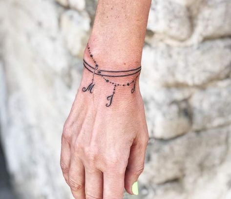 Initial Bracelet Tattoo, Charm Bracelet Tattoos, Bracelet Tattoo Wrist, Wrist Bracelet Tattoos For Women, Armband Tattoo Frau, Tattoo With Kids Names, Bracelet Tattoos With Names, Bracelet Tatoo, Charm Bracelet Tattoo