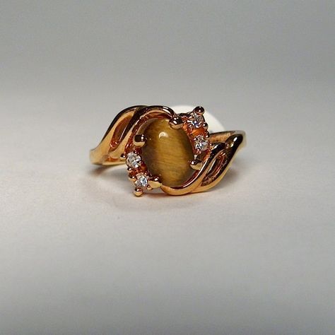 Vintage Dolphin Ore 18k Gold Electroplated Tigers Eye Semi Precious Ring Nickle Free Minimalist Dainty Size 7. Stunning Dainty Minimalist Ring With Tiger's Eye Stone And Crystal Rhinestones. Gleaming 18k Gold Electroplated Band And Setting. About The Company: Best Known Throughout Europe For Its Excellent Workmanship, Dolphin Ore (Gold Dolphin) Is Founded In 1994 Private Company. Located At Rishon Lezion, Israel, The Company Produced Luxury Costume Jewelry Imitating Products Of Such Iconic Brand Multi Band Ring, Royal Diamond, Dainty Wedding Ring, Big Stone Ring, Precious Rings, Blue Diamond Ring, Costume Jewelry Rings, Beautiful Wedding Rings, Private Company