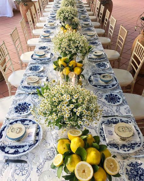 Mediterranean inspired tablescape. Custom designed table cloth, white and blue china bone chargers, tambourines with guests portraits and… Sangeet Board, White And Blue China, Lemon Tablescape, Italian Bridal Showers, Mediterranean Table, Dinner Party Table Settings, Bbq Night, Italian Dinner Party, Italian Party